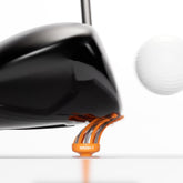 orange oversize golf tee highlighting flexible bristles.